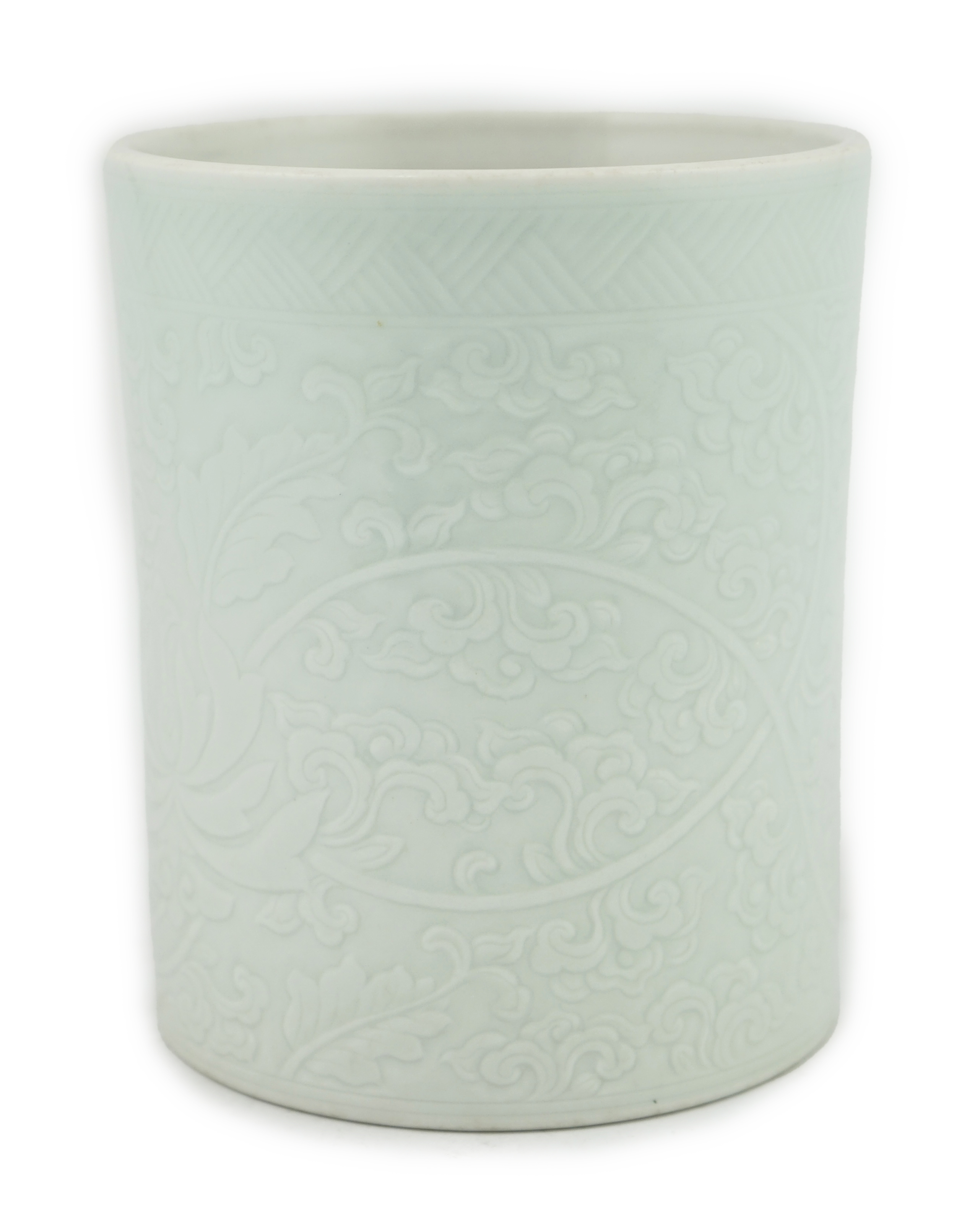 A Chinese celadon glazed brush pot, Kangxi style, 15.5cm high. Condition - good